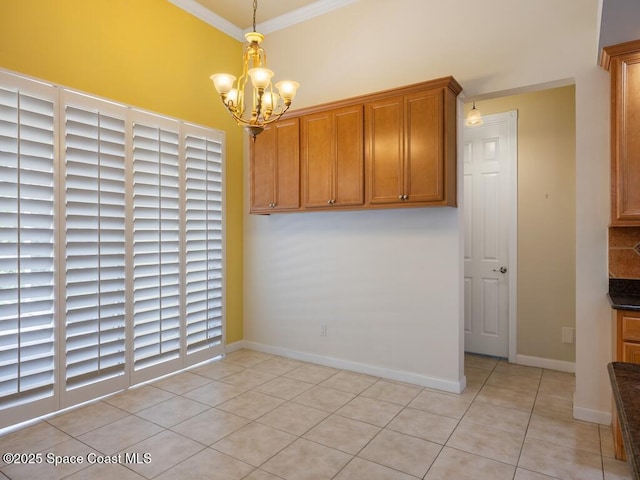 5422 Barbados Sq, Vero Beach, FL 32967 - unfurnished dining area featuring a chandelier, light tile patterned flooring, ornamental molding, and baseboards