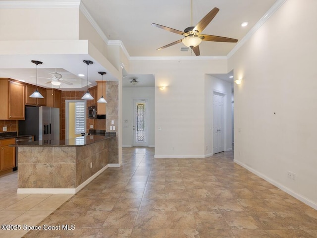 5422 Barbados Sq, Vero Beach, FL 32967 - kitchen featuring a ceiling fan, stainless steel appliances, dark countertops, crown molding, and baseboards