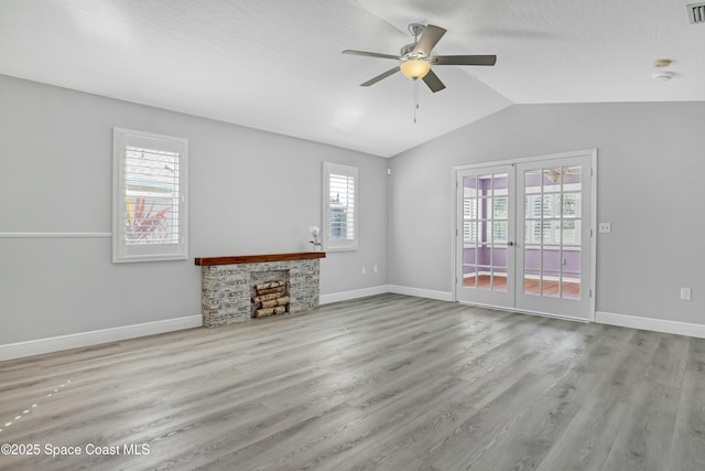 1020 S Fork Cir, Melbourne, FL 32901 - unfurnished living room with a ceiling fan, vaulted ceiling, wood finished floors, and french doors