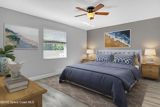 1020 S Fork Cir, Melbourne, FL 32901 - bedroom featuring wood finished floors and a ceiling fan