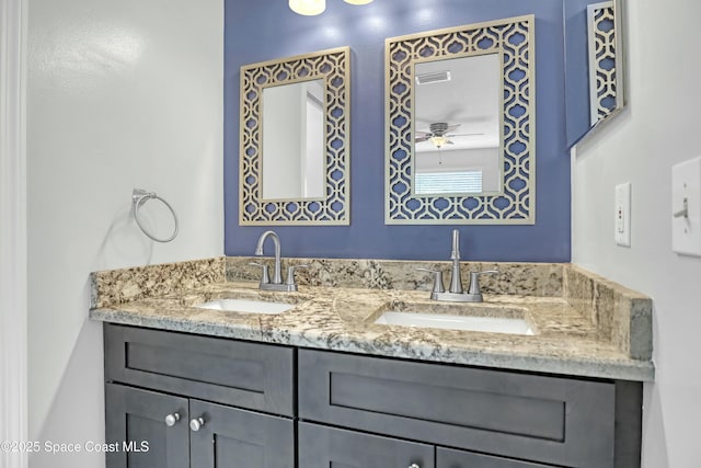 1020 S Fork Cir, Melbourne, FL 32901 - bathroom with double vanity and a ceiling fan
