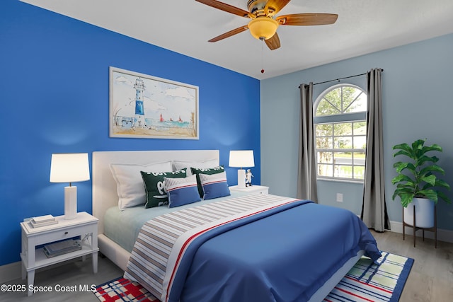 1020 S Fork Cir, Melbourne, FL 32901 - bedroom with wood finished floors and ceiling fan
