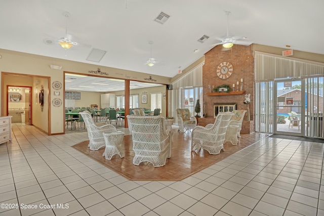 1020 S Fork Cir, Melbourne, FL 32901 - living area with ceiling fan, high vaulted ceiling, and a brick fireplace