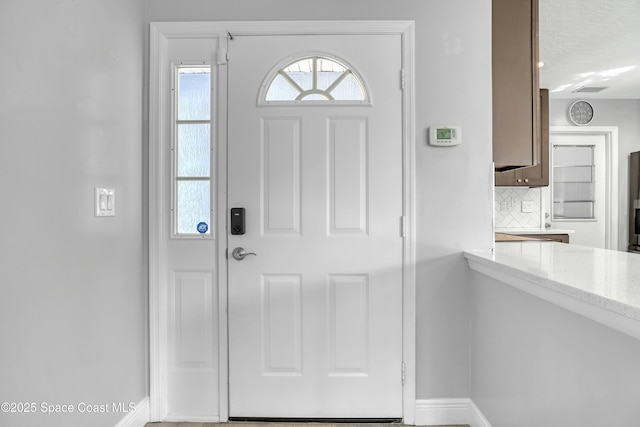 1020 S Fork Cir, Melbourne, FL 32901 - foyer entrance featuring baseboards