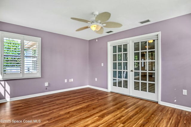 1020 S Fork Cir, Melbourne, FL 32901 - empty room featuring a ceiling fan and wood finished floors