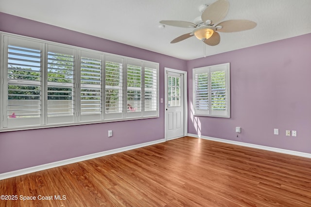 1020 S Fork Cir, Melbourne, FL 32901 - unfurnished room with wood finished floors and a ceiling fan