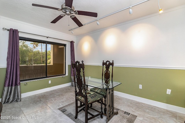 2260 Front St Unit 103, Melbourne, FL 32901 - office space featuring ornamental molding, a ceiling fan, rail lighting, tile patterned flooring, and baseboards