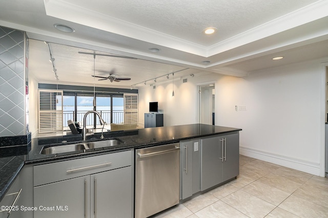 2260 Front St Unit 103, Melbourne, FL 32901 - kitchen with stainless steel dishwasher, a sink, rail lighting, ceiling fan, and ornamental molding