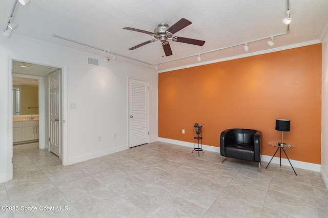 2260 Front St Unit 103, Melbourne, FL 32901 - unfurnished room featuring rail lighting, crown molding, ceiling fan, and a sink