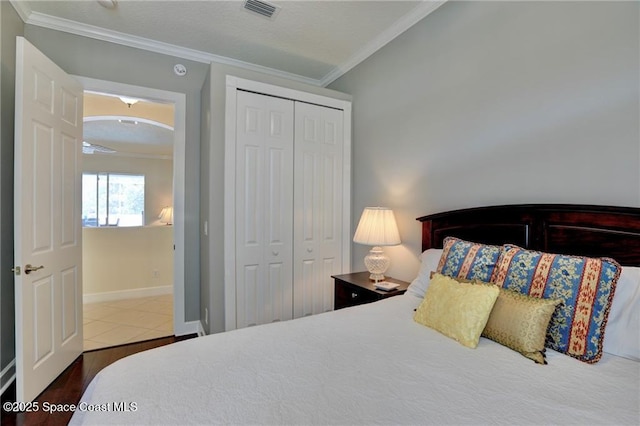 1641 Galilean Ln, Sebastian, FL 32958 - bedroom with ornamental molding, a closet, wood finished floors, and baseboards