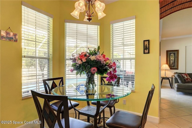 1641 Galilean Ln, Sebastian, FL 32958 - dining room featuring a chandelier, light tile patterned floors, and baseboards