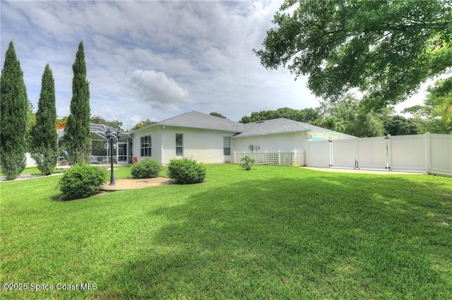 1641 Galilean Ln, Sebastian, FL 32958 - view of yard with a lanai and a gate