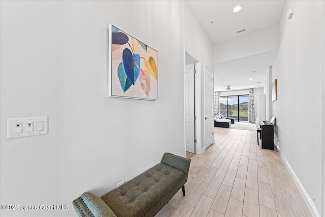 7917 Dobre Way, Melbourne, FL 32940 - hallway featuring light wood-style flooring and recessed lighting