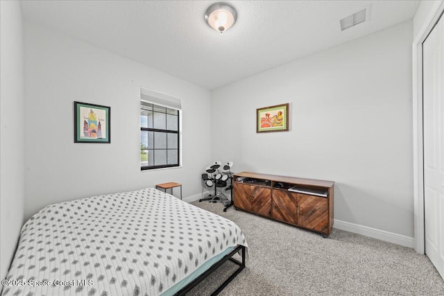 7917 Dobre Way, Melbourne, FL 32940 - bedroom featuring baseboards, carpet floors, and a textured ceiling