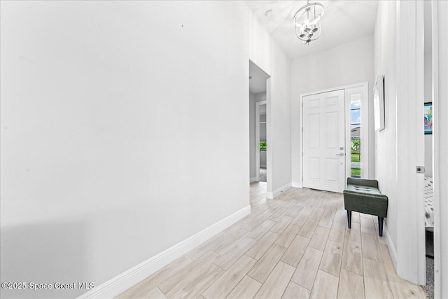 7917 Dobre Way, Melbourne, FL 32940 - entrance foyer with a chandelier and light wood-type flooring