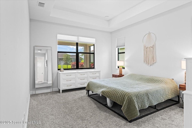 7917 Dobre Way, Melbourne, FL 32940 - carpeted bedroom with a tray ceiling and baseboards