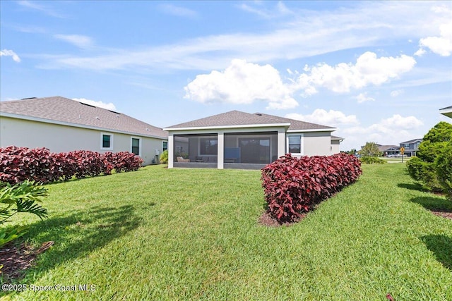7917 Dobre Way, Melbourne, FL 32940 - rear view of house featuring a sunroom and a yard