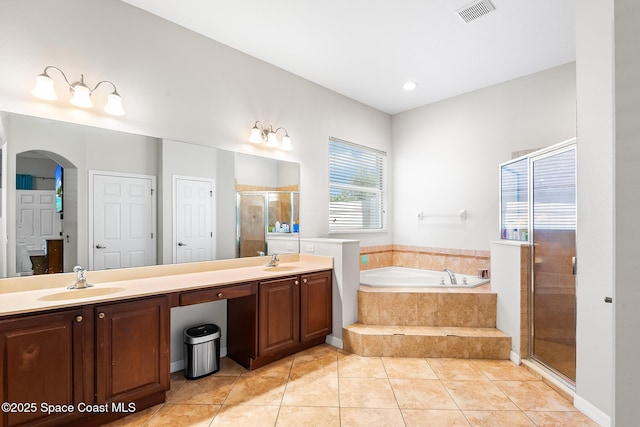 125 Rudy St, Auburndale, FL 33823 - bathroom featuring a shower stall, a garden tub, double vanity, and tile patterned floors