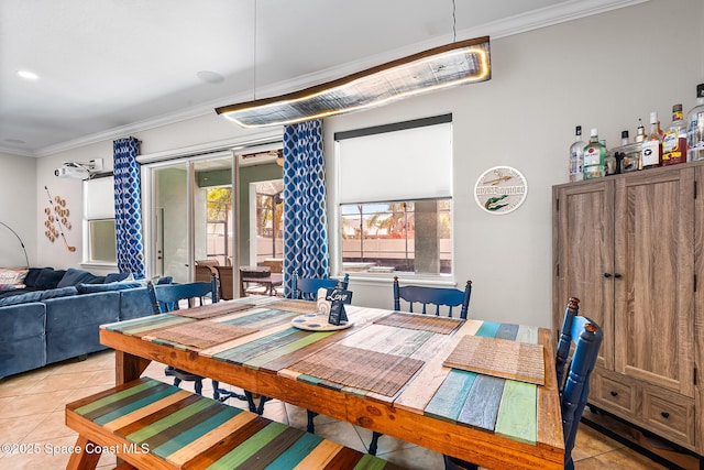 125 Rudy St, Auburndale, FL 33823 - dining room featuring light tile patterned floors and ornamental molding