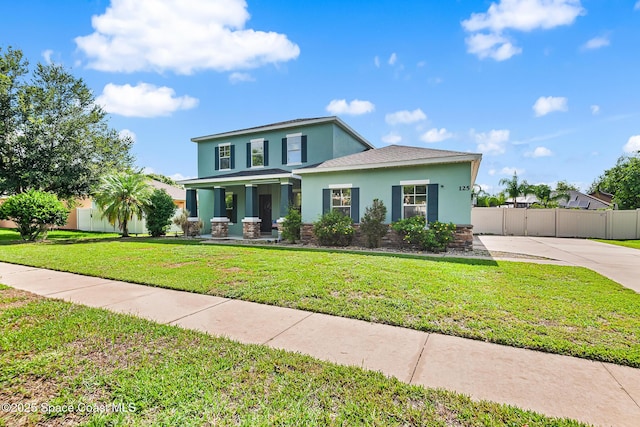 125 Rudy St, Auburndale, FL 33823 - view of front of home featuring stucco siding and a porch