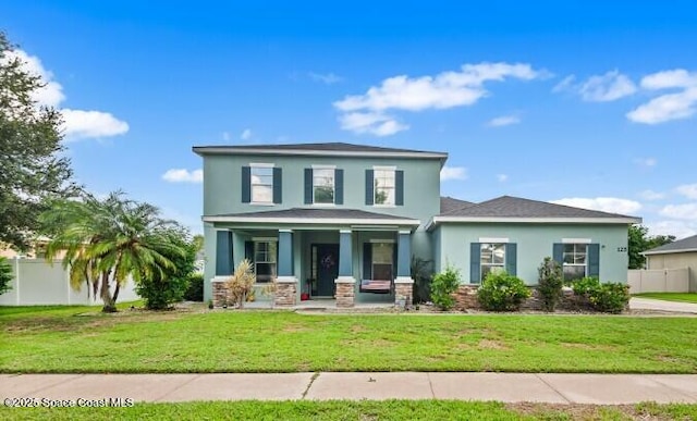 125 Rudy St, Auburndale, FL 33823 - view of front of home featuring a porch and stucco siding