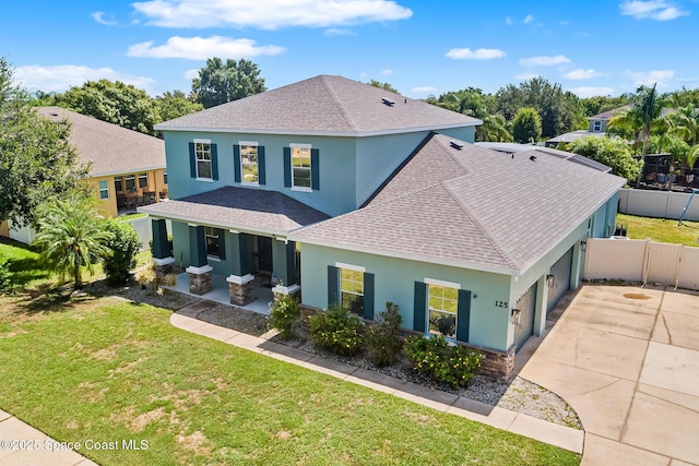 125 Rudy St, Auburndale, FL 33823 - view of front of home with a shingled roof, stucco siding, driveway, and an attached garage