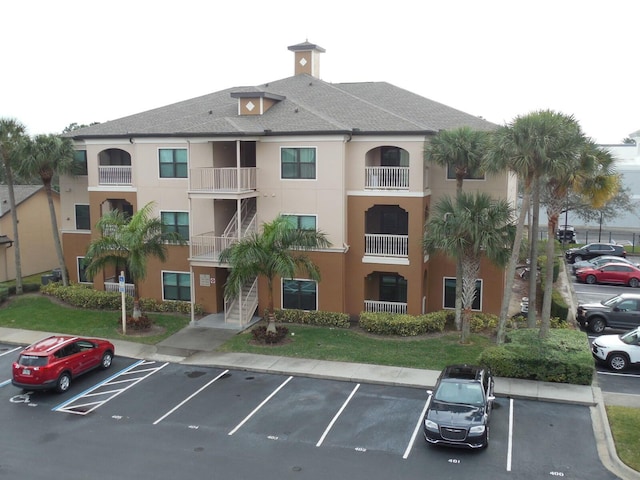 6460 Borasco Dr Unit 2903, Melbourne, FL 32940 - view of building exterior with uncovered parking