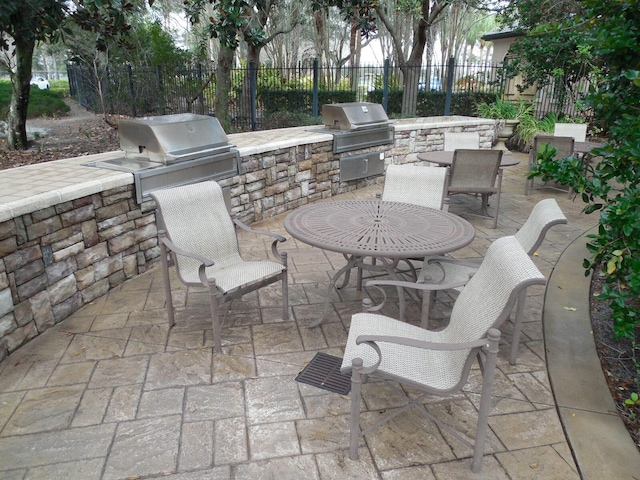 6460 Borasco Dr Unit 2903, Melbourne, FL 32940 - view of patio with an outdoor kitchen
