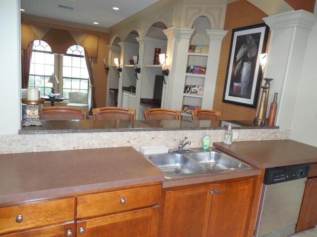 6460 Borasco Dr Unit 2903, Melbourne, FL 32940 - kitchen featuring ornate columns, stainless steel dishwasher, and brown cabinetry