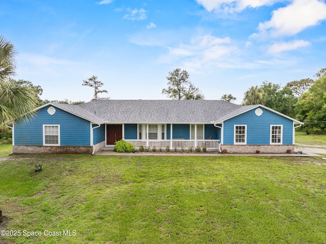3435 Felda St, Cocoa, FL 32926 - ranch-style home featuring a porch, brick siding, a front yard, and roof with shingles