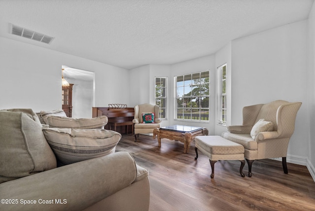 3435 Felda St, Cocoa, FL 32926 - living room with wood finished floors and a textured ceiling