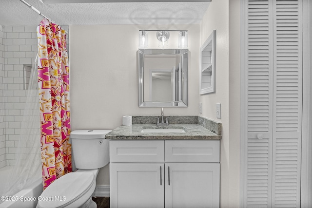 3435 Felda St, Cocoa, FL 32926 - bathroom with a closet, a textured ceiling, toilet, vanity, and shower / bath combo with shower curtain