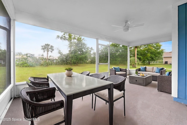 3435 Felda St, Cocoa, FL 32926 - sunroom featuring an outdoor living space with a fire pit, ceiling fan, and outdoor dining space