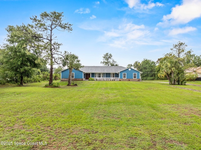 3435 Felda St, Cocoa, FL 32926 - view of front of house with a front yard