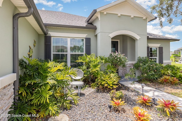 718 Lyndall Ln, Palm Bay, FL 32905 - view of front of property featuring stucco siding and a shingled roof