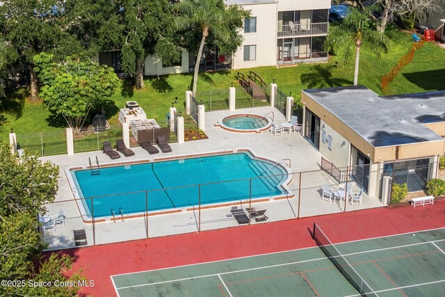 200 International Dr Unit 817, Cape Canaveral, FL 32920 - community pool featuring a community hot tub and a patio area