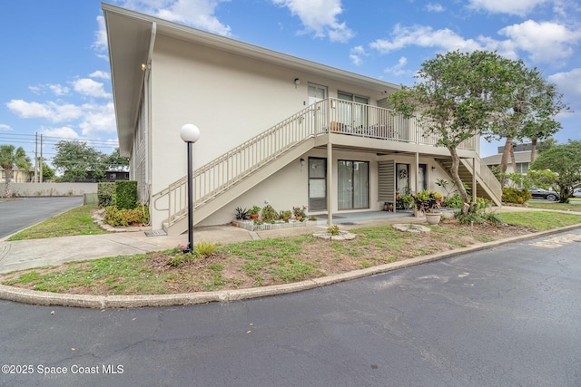 1935 Conway Rd Unit A4, Orlando, FL 32812 - view of front of property featuring stairway and stucco siding