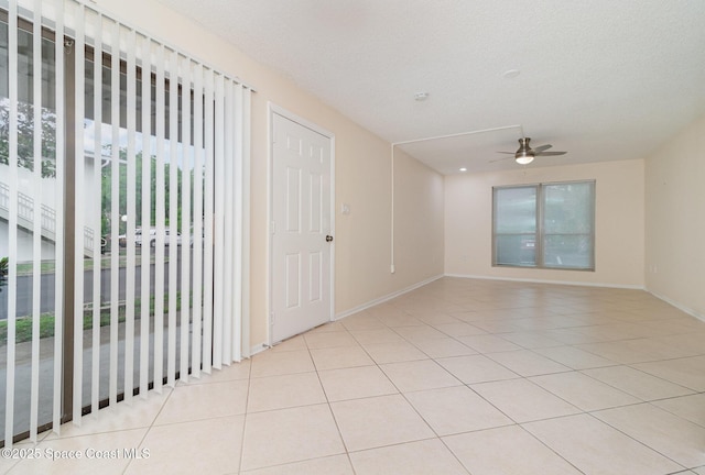 1935 Conway Rd Unit A4, Orlando, FL 32812 - unfurnished room featuring ceiling fan, light tile patterned floors, and baseboards