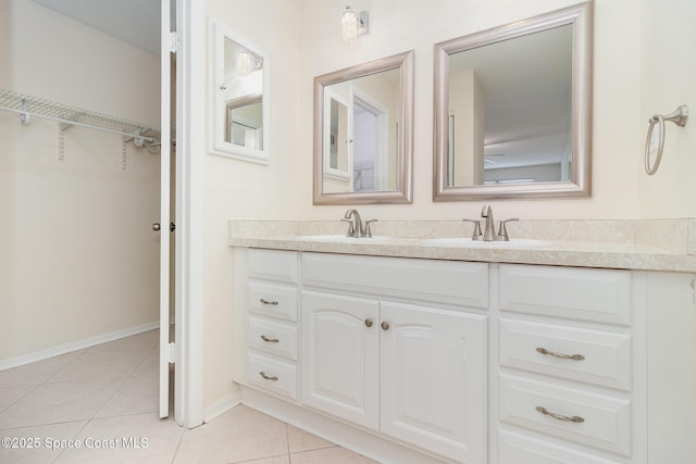 1935 Conway Rd Unit A4, Orlando, FL 32812 - full bath featuring double vanity, tile patterned floors, a spacious closet, and baseboards