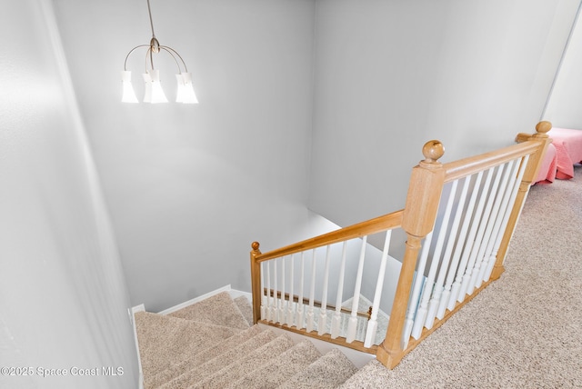 5201 Ocean Beach Blvd Unit 4, Cocoa Beach, FL 32931 - stairway with carpet and a chandelier