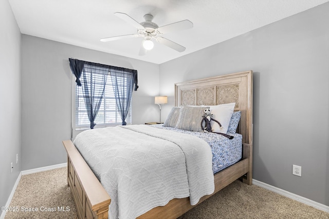 5201 Ocean Beach Blvd Unit 4, Cocoa Beach, FL 32931 - carpeted bedroom featuring baseboards and a ceiling fan
