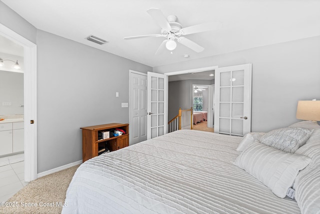 5201 Ocean Beach Blvd Unit 4, Cocoa Beach, FL 32931 - bedroom featuring light carpet, ceiling fan, and connected bathroom