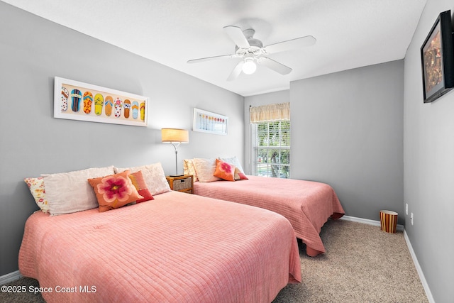 5201 Ocean Beach Blvd Unit 4, Cocoa Beach, FL 32931 - bedroom with carpet and a ceiling fan