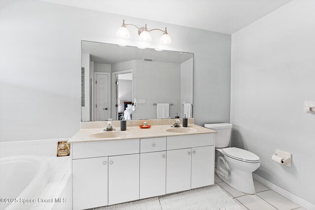 5201 Ocean Beach Blvd Unit 4, Cocoa Beach, FL 32931 - bathroom with double vanity, a garden tub, and tile patterned flooring