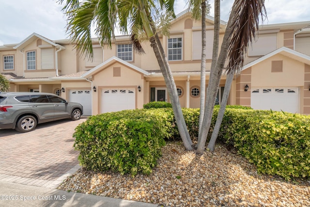 5201 Ocean Beach Blvd Unit 4, Cocoa Beach, FL 32931 - multi unit property with stucco siding and driveway