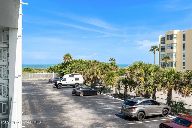 4800 Ocean Beach Blvd Unit 218, Cocoa Beach, FL 32931 - uncovered parking lot with a water view