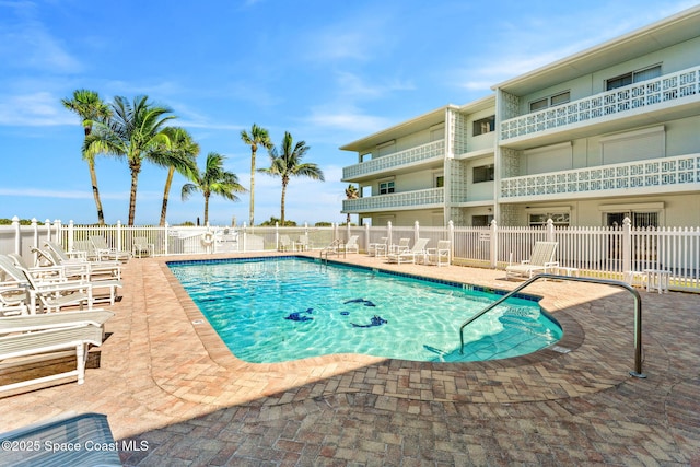 4800 Ocean Beach Blvd Unit 218, Cocoa Beach, FL 32931 - community pool with a patio area