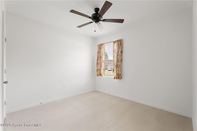 1093 Wabash Rd SE, Palm Bay, FL 32909 - unfurnished room featuring baseboards, ceiling fan, and light carpet