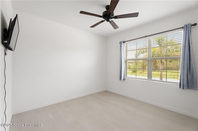 1093 Wabash Rd SE, Palm Bay, FL 32909 - unfurnished room featuring a ceiling fan and baseboards