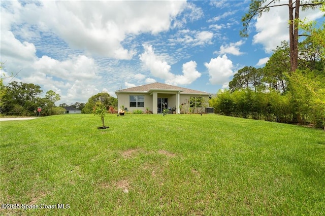 1093 Wabash Rd SE, Palm Bay, FL 32909 - view of grassy yard featuring cooling unit